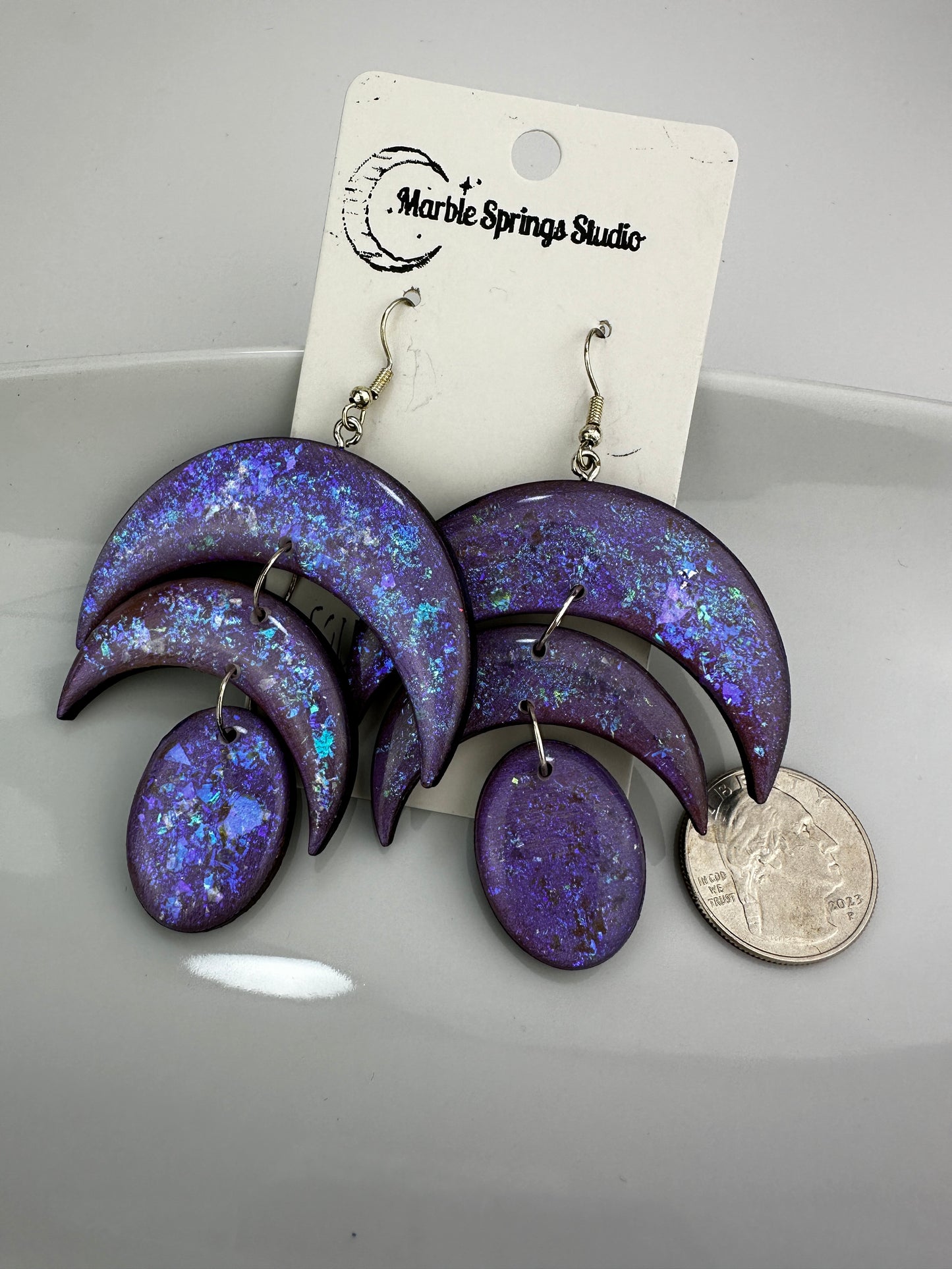 Purple iridescent, wood, and resin dangle earrings