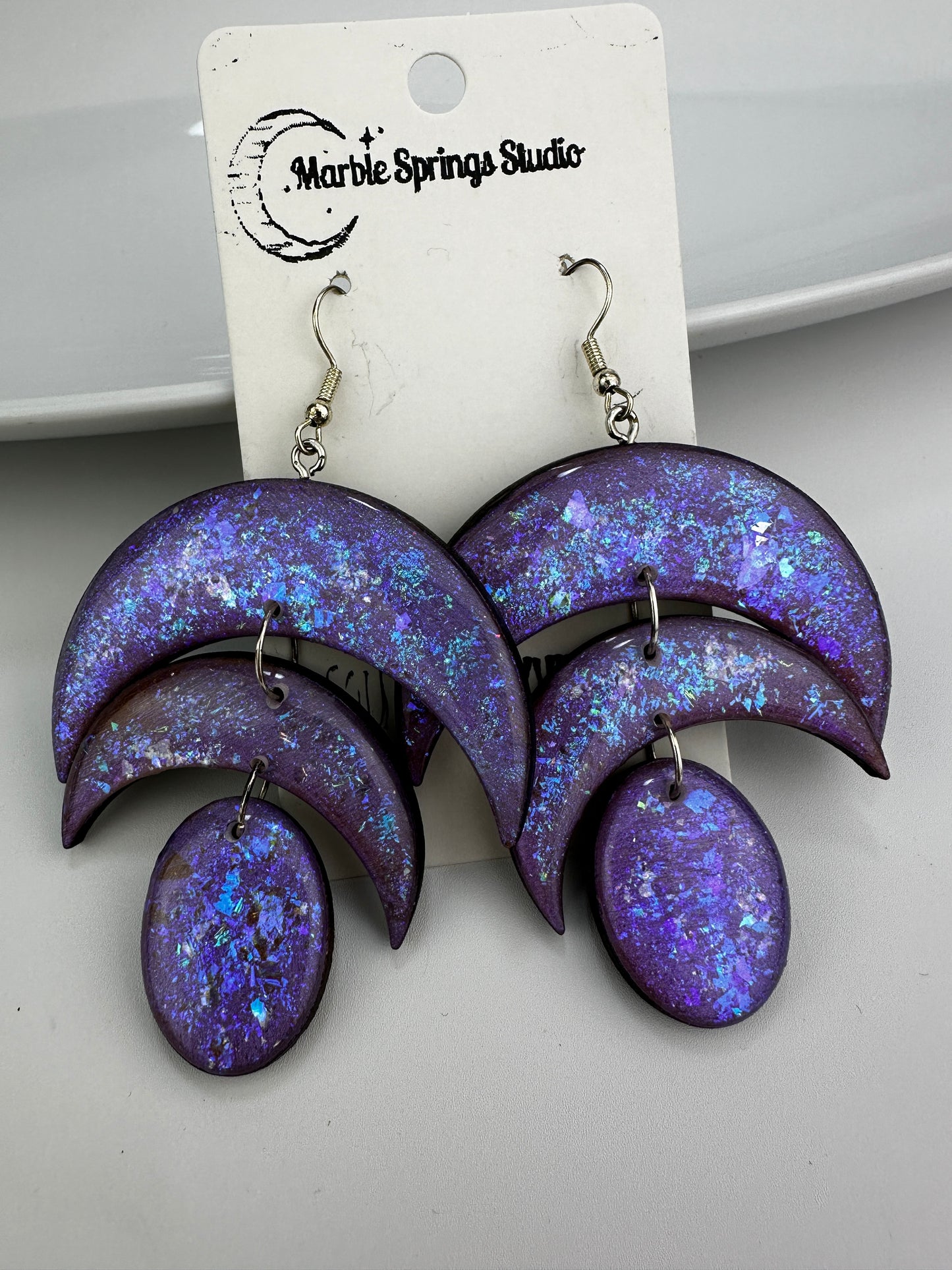 Purple iridescent, wood, and resin dangle earrings